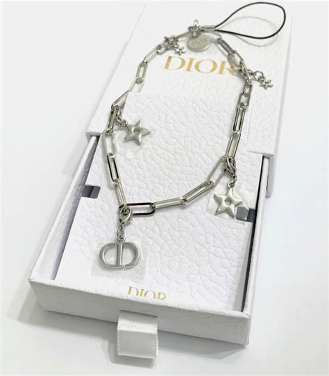 complimentary dior phone charm.